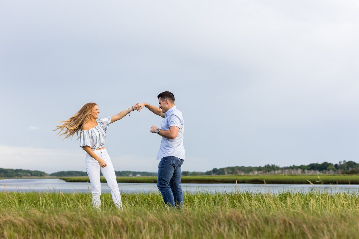 groom-spins-bride-at-beach-engagement-lisa-gilbert-photography