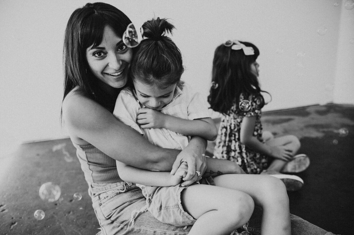 mother holding son during family photos in Portland