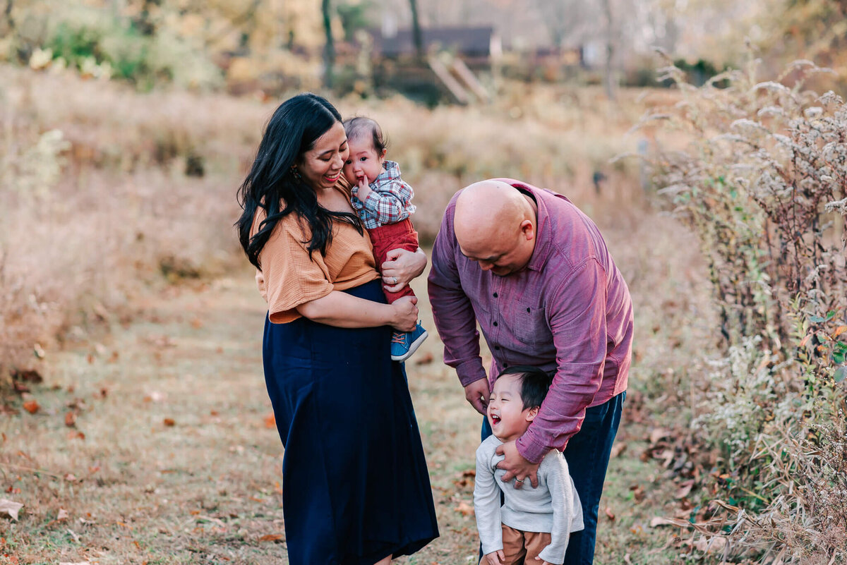A joyful moment during a family session in Northern Virginia by Denise Van