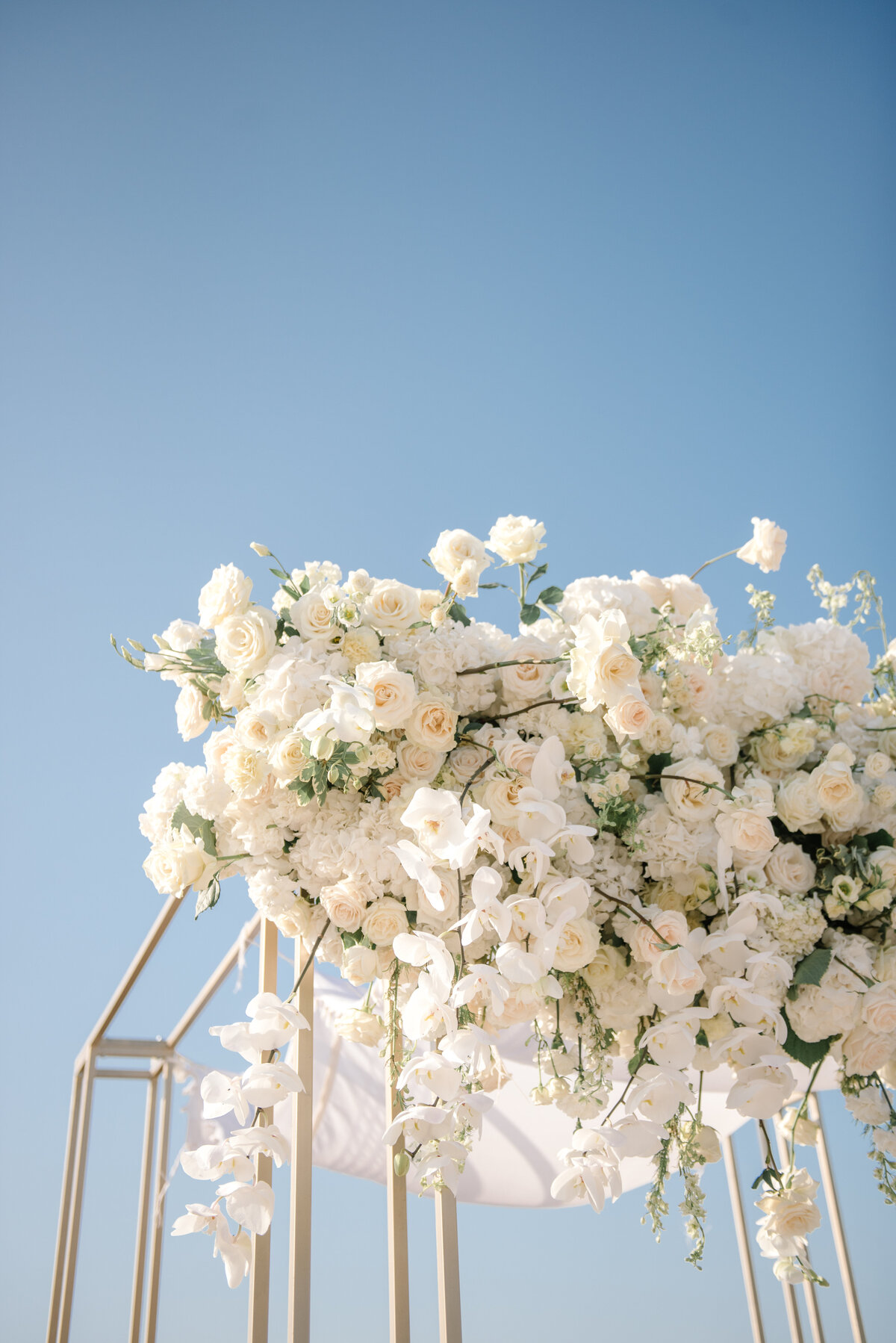 chuppah with white orchids and roses at cap rocat mallorca