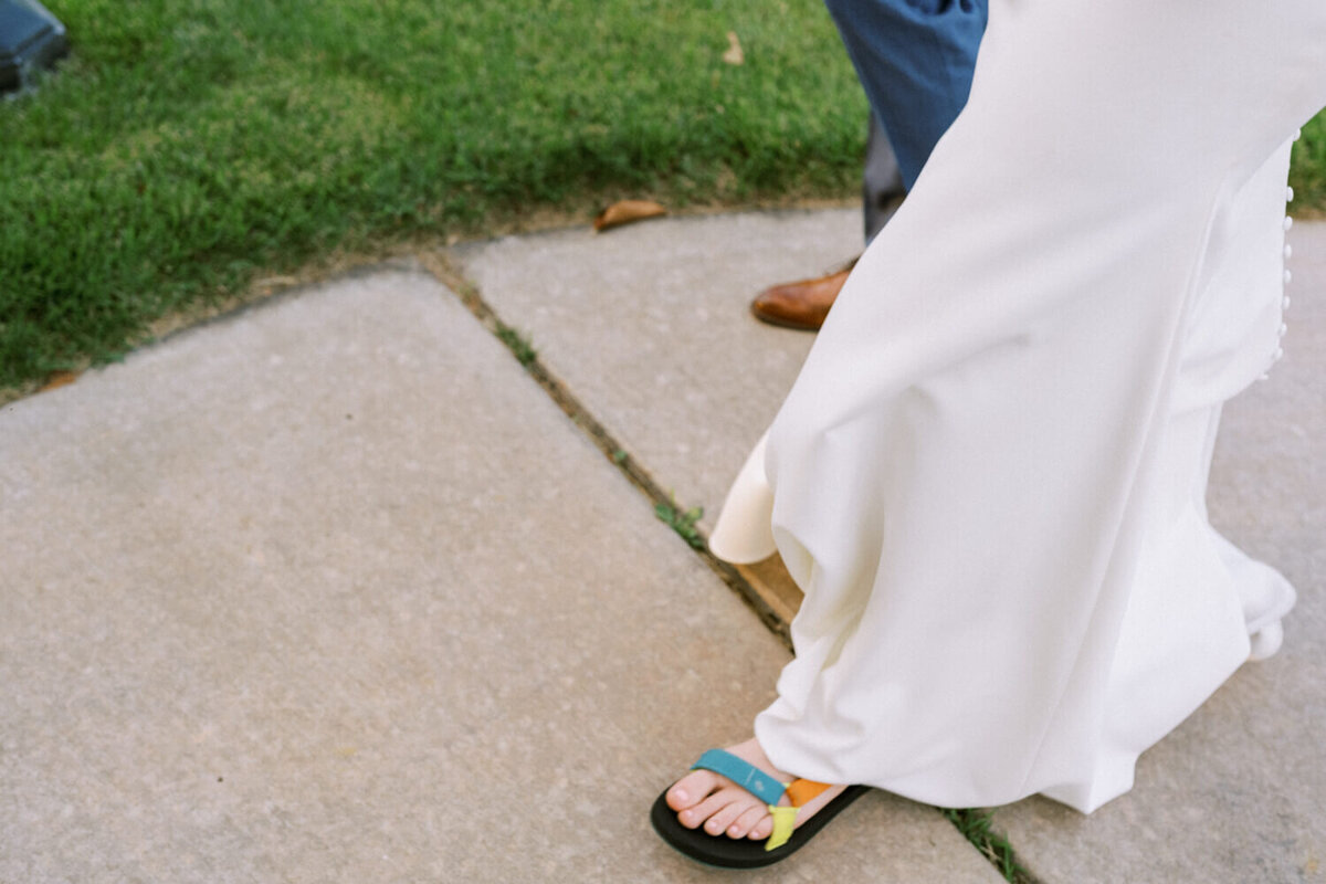 bride-wearing-chacos-sandals-under-dress