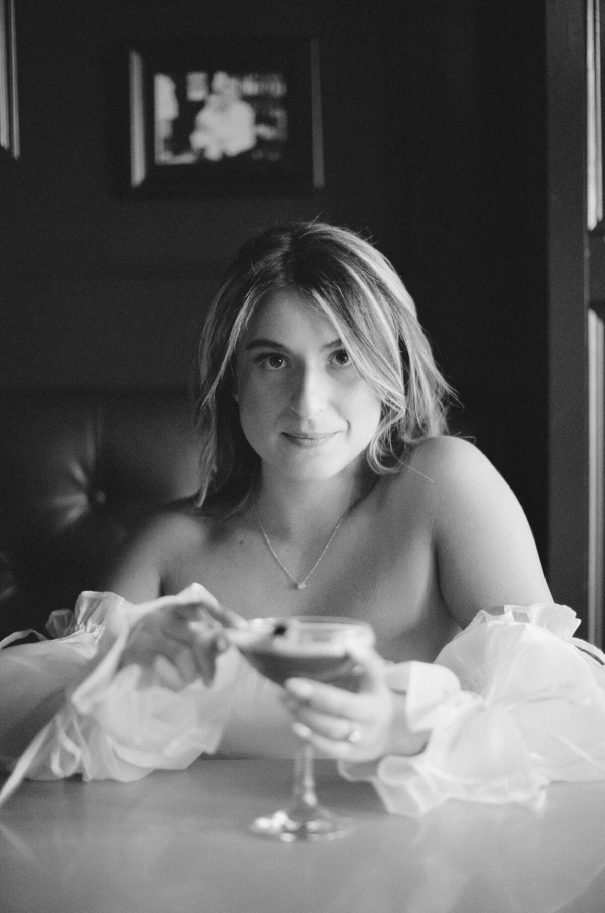 35mm film engagement photo of bride at Wonderbar in Beacon, NY holding a martini