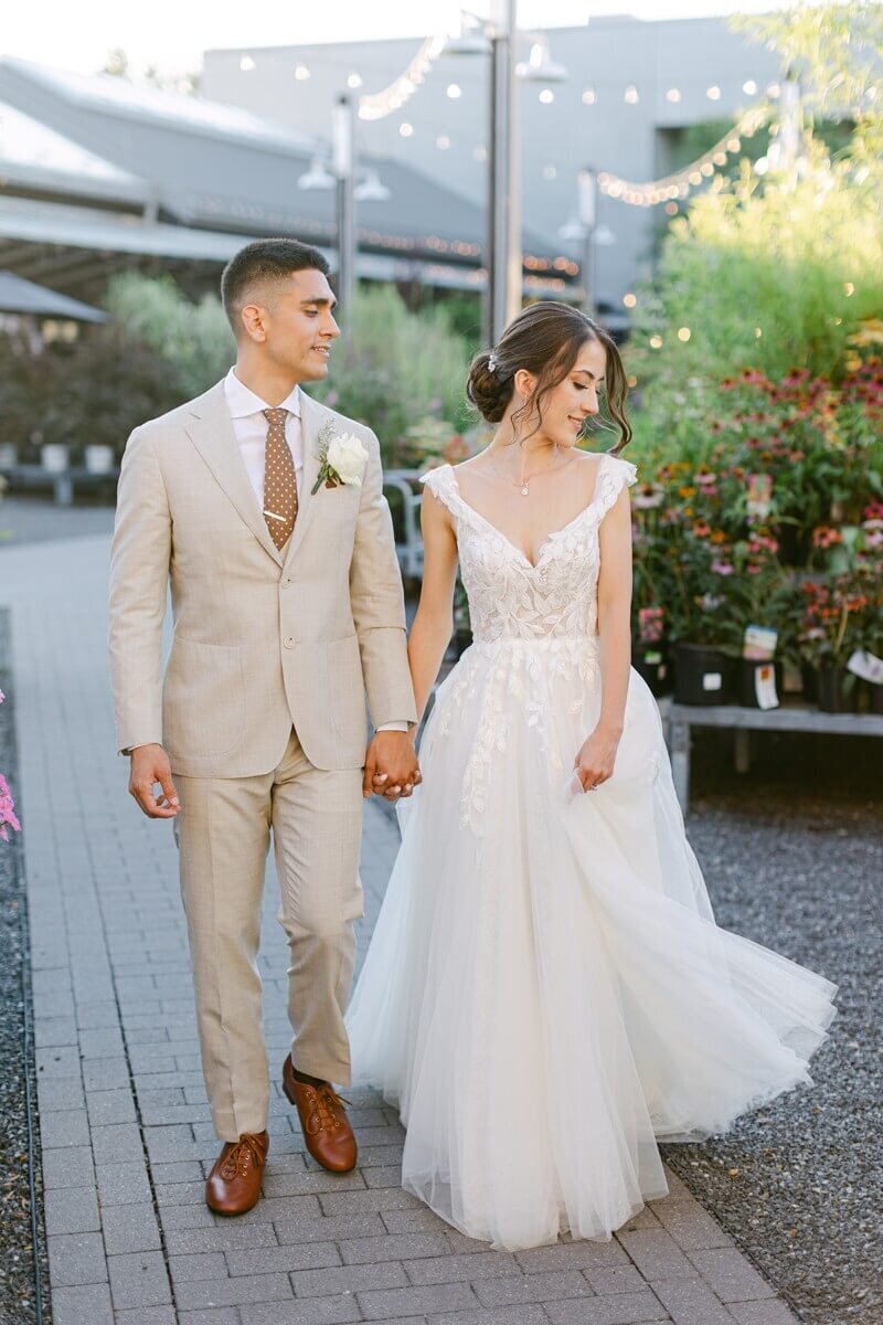 bride and groom walking through terrain gardens