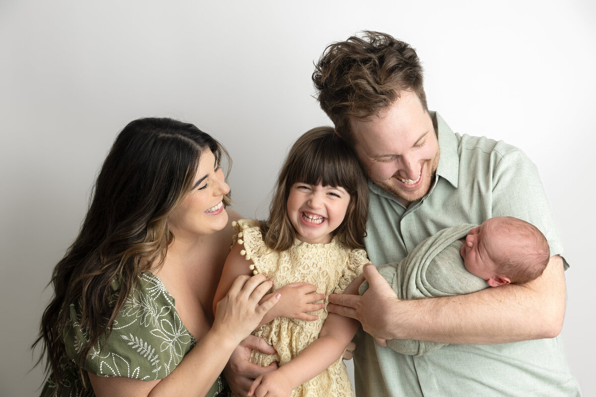 Mom dad toddler and baby portrait 