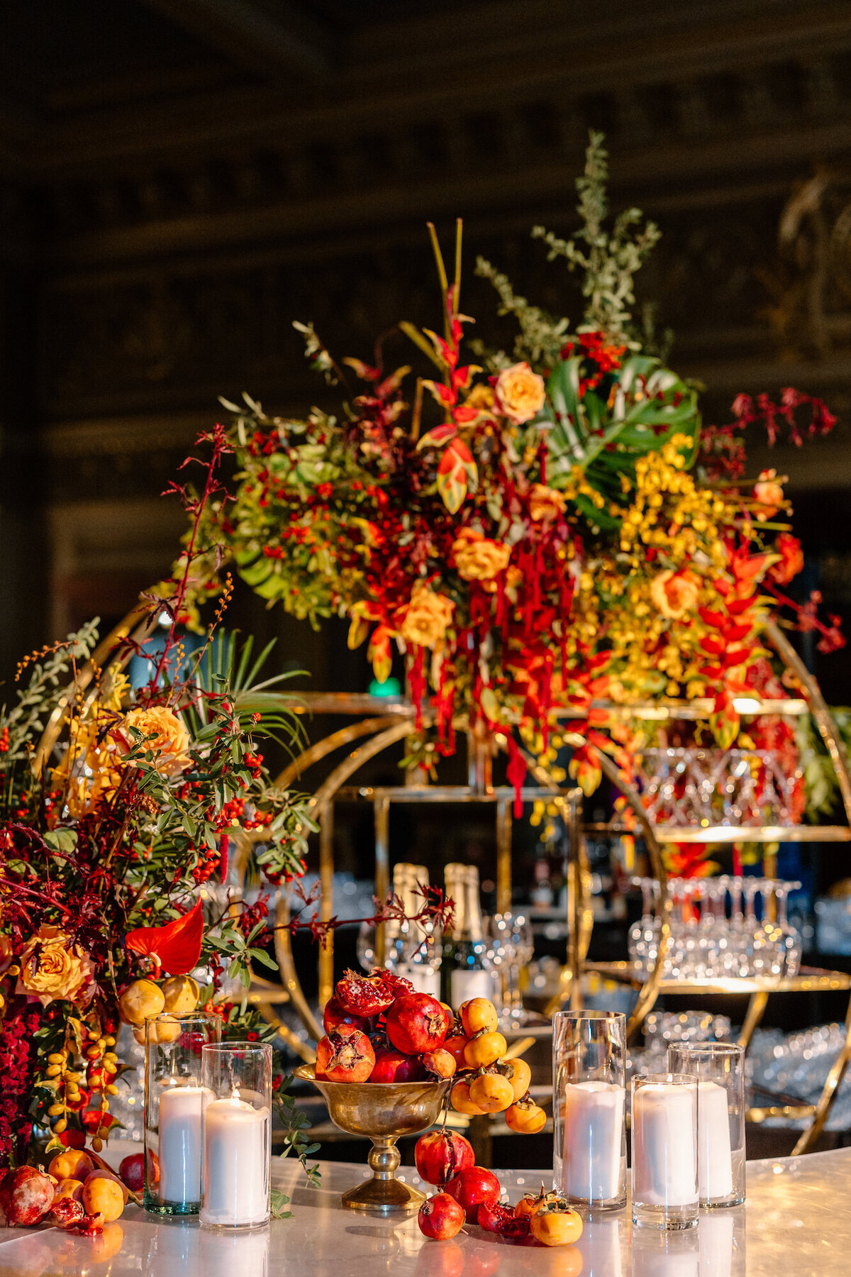 Bar dripping with florals, fruit, and candles