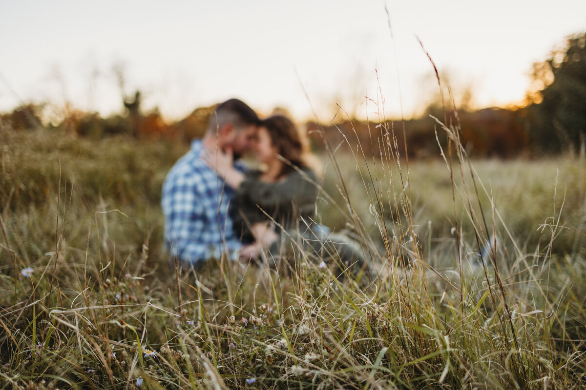 couple embracing in field