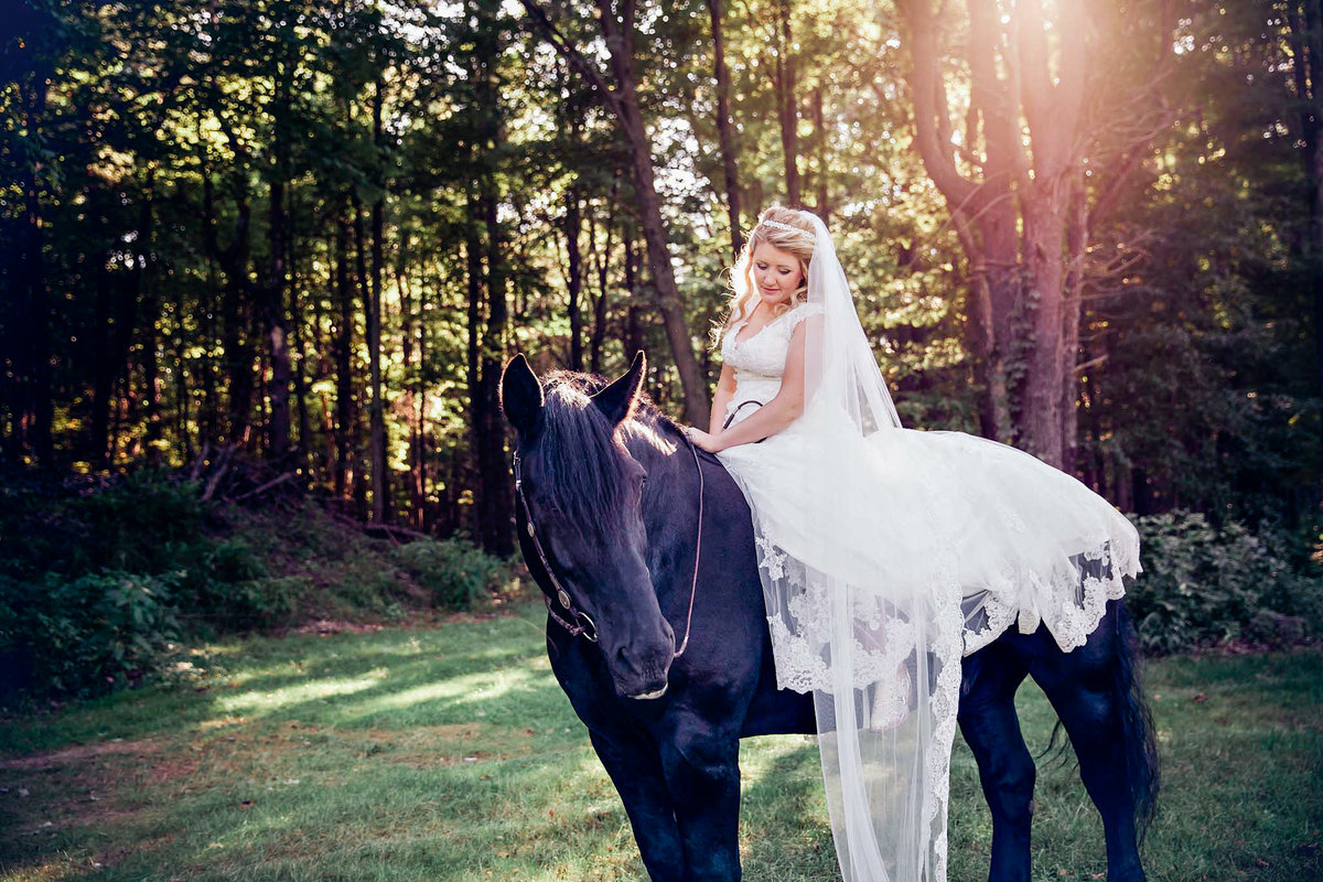Bride riding a horse on her wedding day.