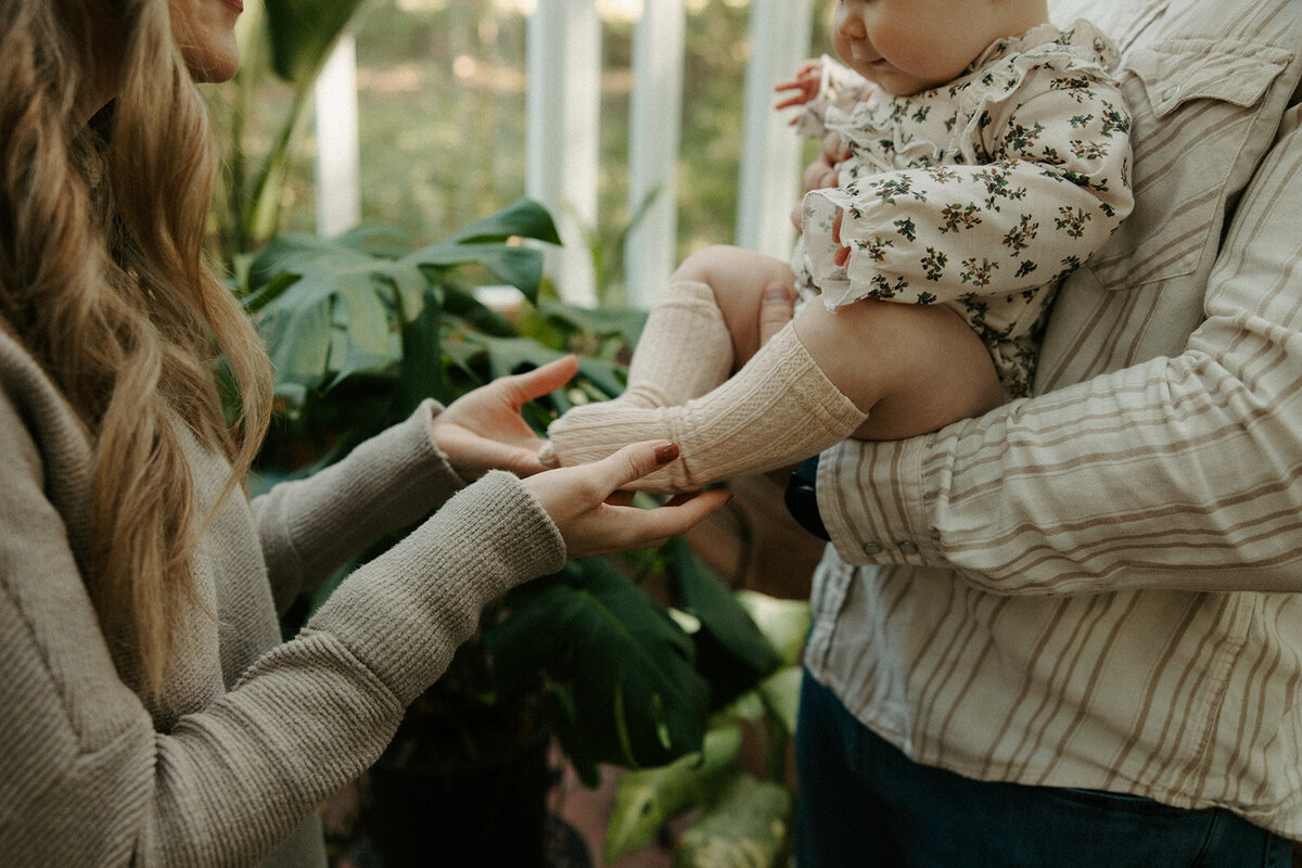 close up of family playing during a photoshoot with Three Bridge Photography