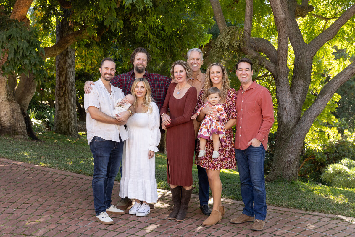 San marino family wearing fall color standing