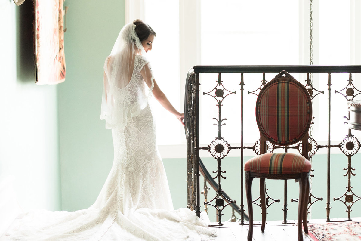 bride coming down cedar hall stairs