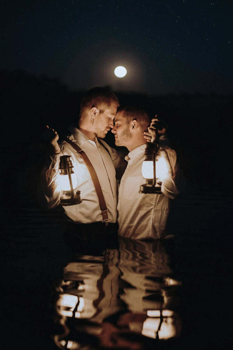 gay-elopement-couple-in-water-with-lanterns-lgbtq