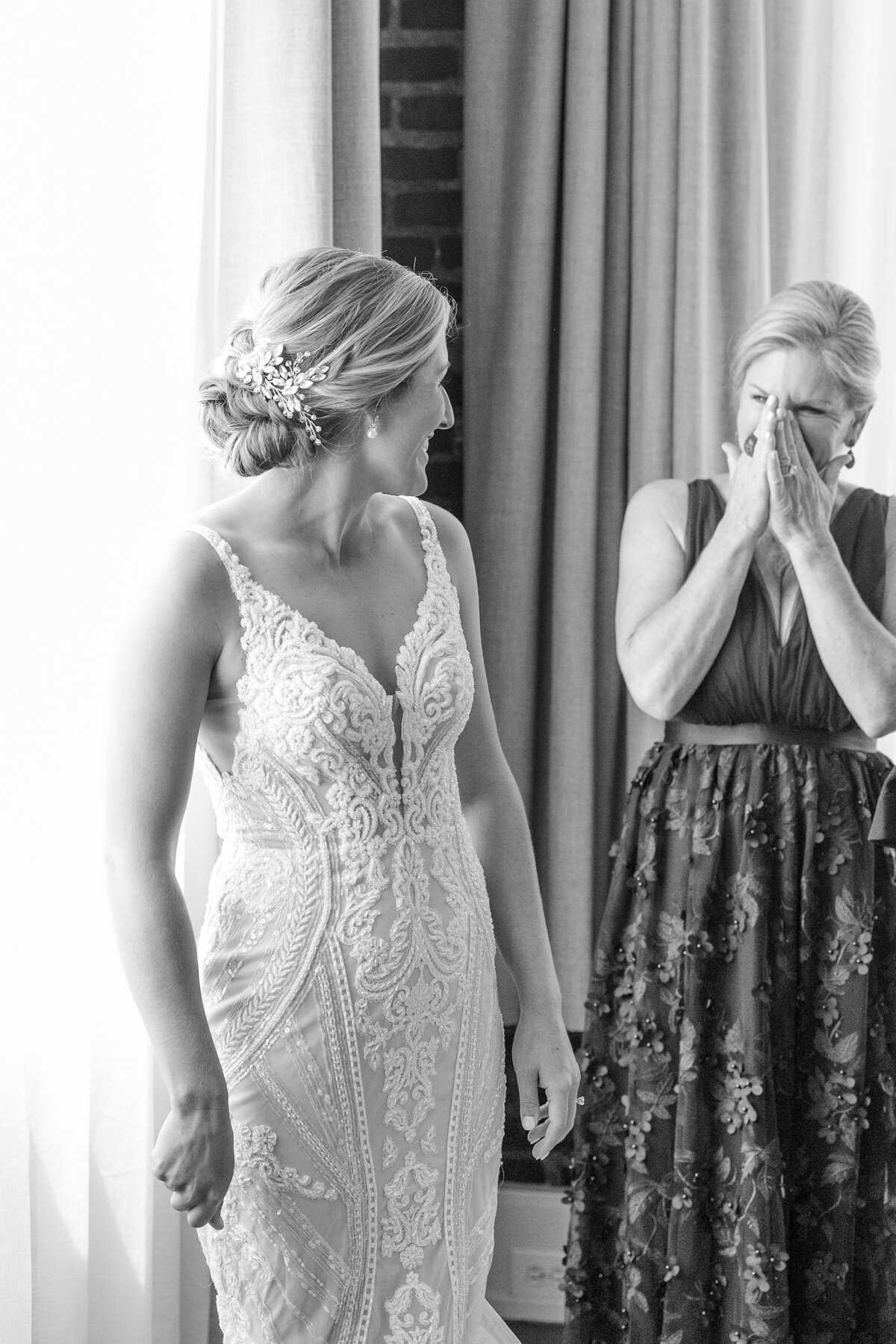 mother of the bride admires her daughter