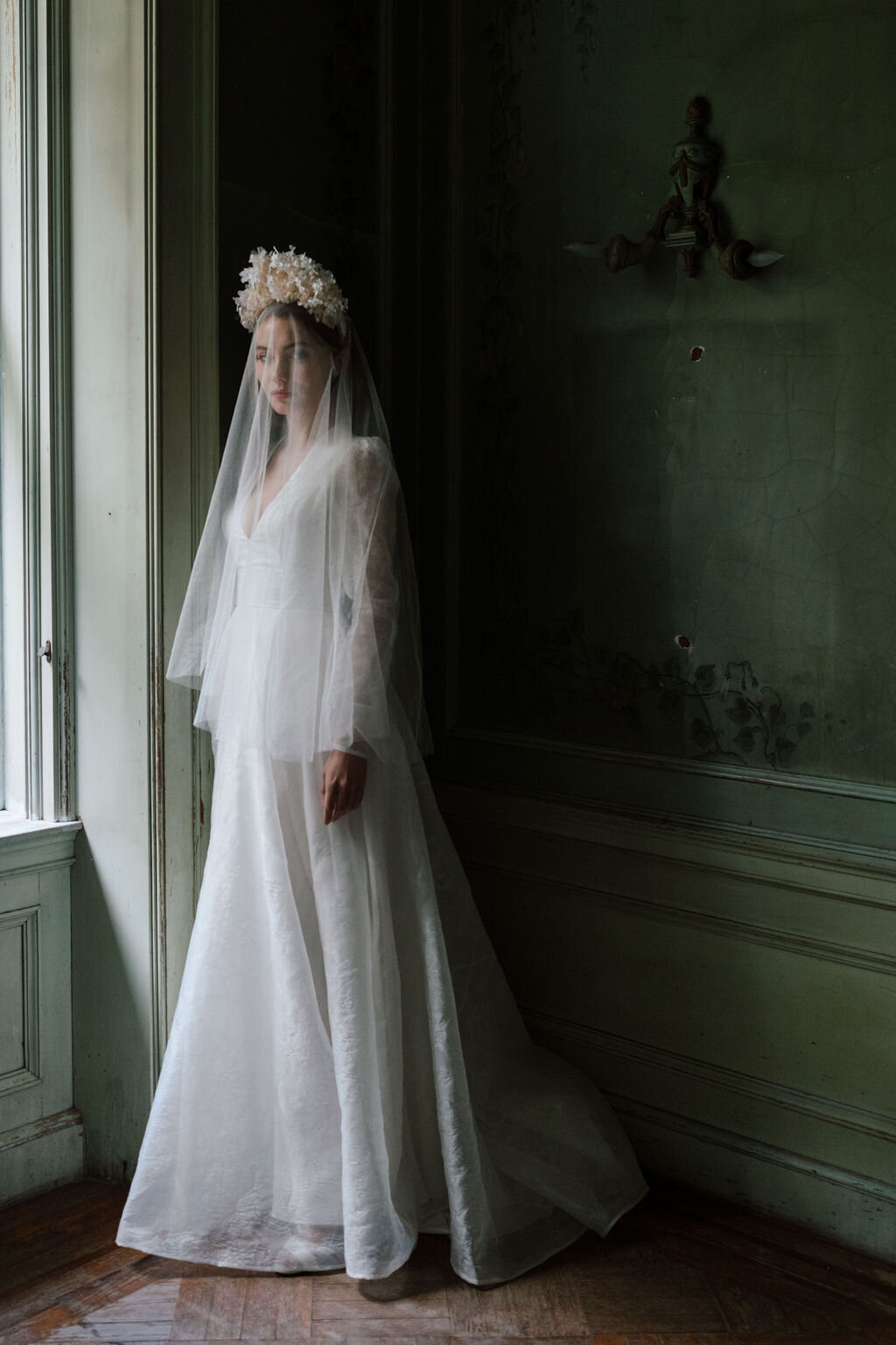 bride in wedding dress in green room mansion