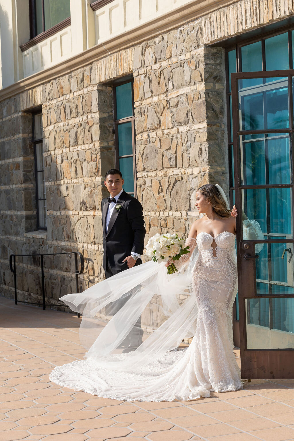 Bride and groom outside the board room at Bel Air Bay Club