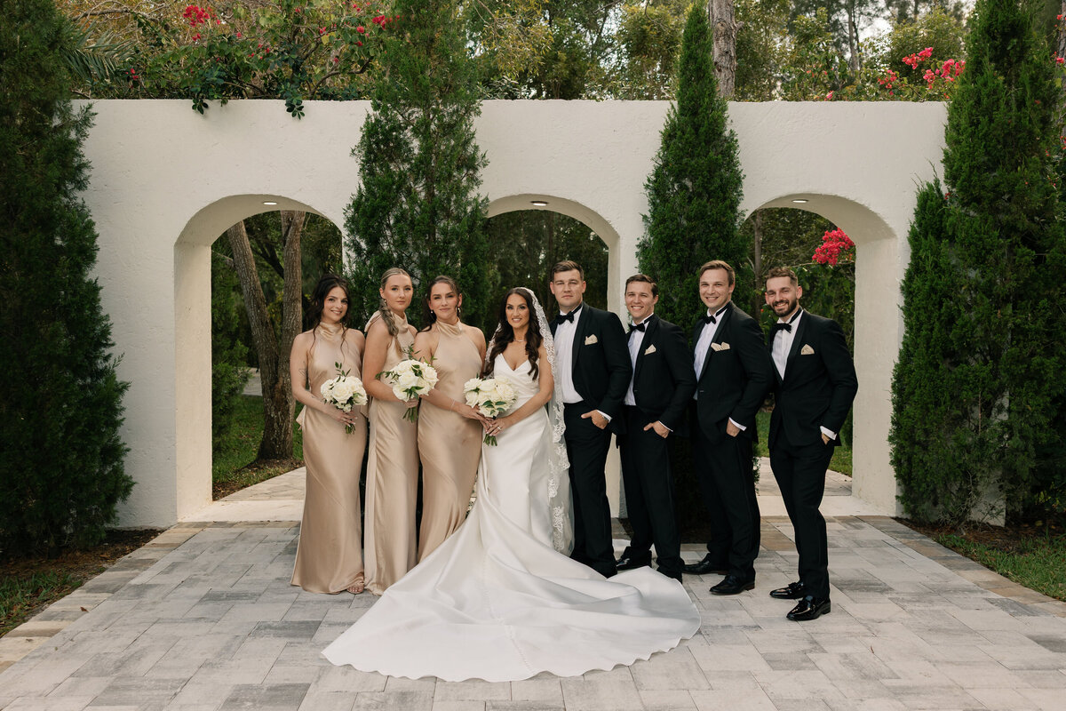 Bridal party portraits with Tuscan-style backdrop at La Casa Toscana