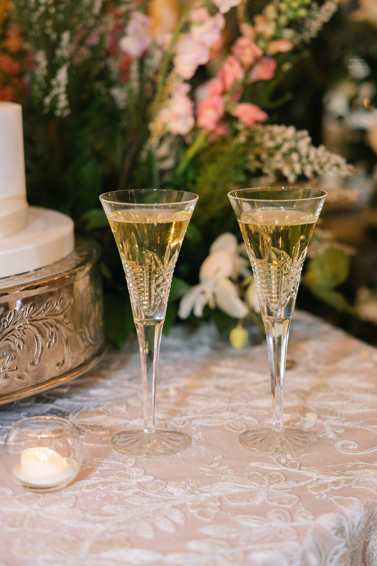 close up photo of crystal glasses with champaign at wedding reception at The Adolphus in Dallas