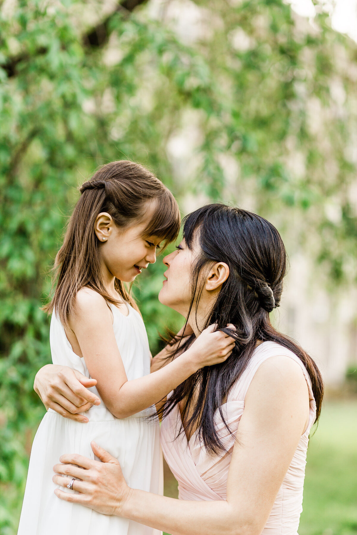 Mother and daughter embracing in NJ outdoor photo  shoot in Westfield, NJ