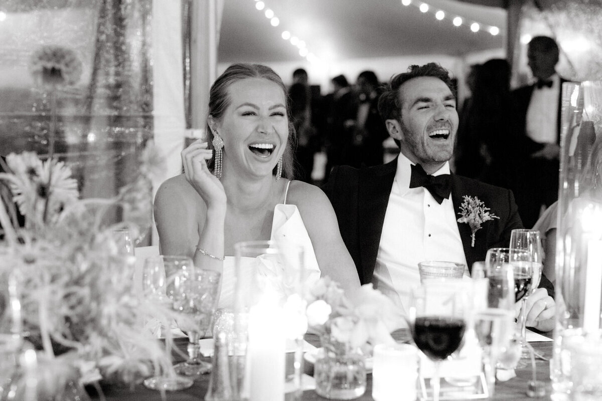 adirondack-mountain-wedding-39-bride-and-groom-sharing-a-quiet-moment-at-reception-at-adirondack-mountain-wedding-jenny-fu-studio