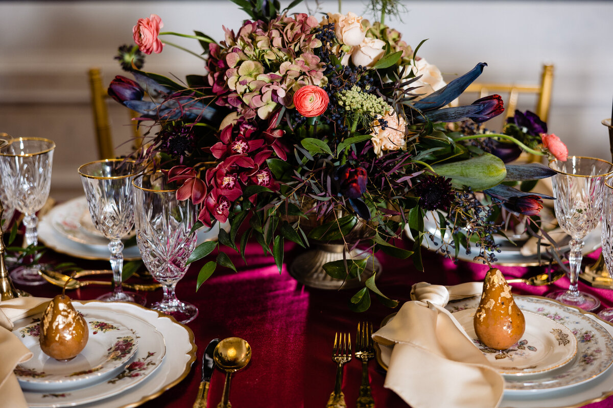 Gothic wedding tablescape with dark flowers