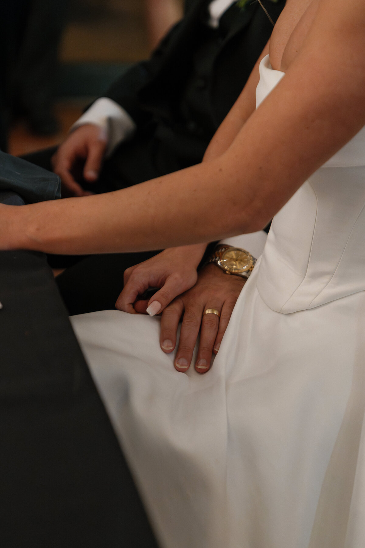 film wedding photography of bride and groom holding hands in each others lap by Shelby Ann Photos