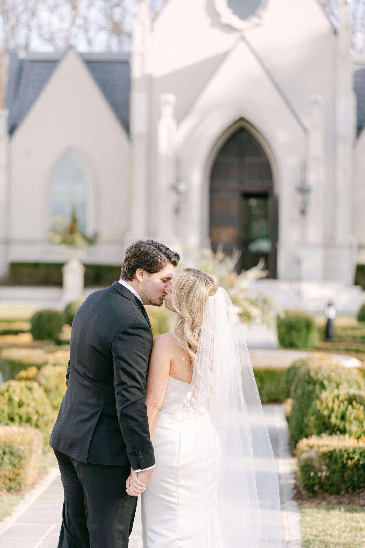 bride and groom out front of park chateau estate and gardens