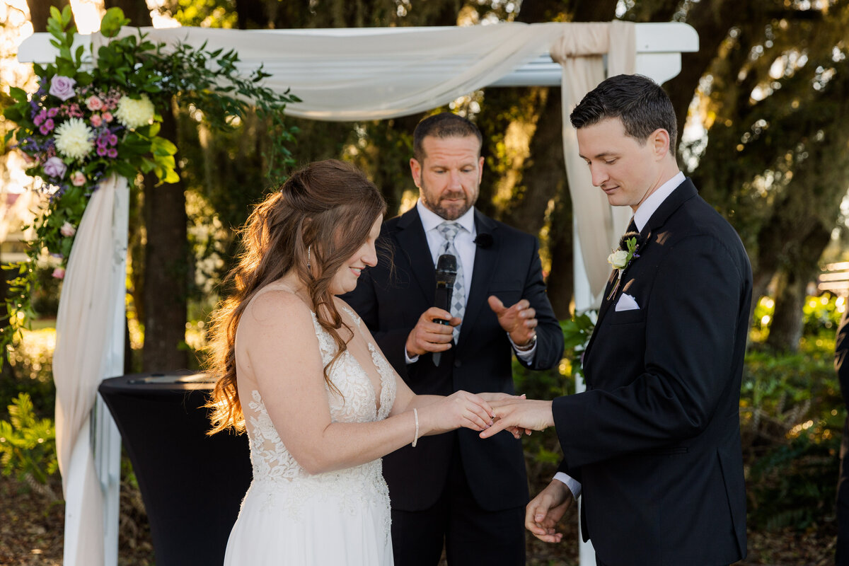 Bride and Groom Ring Exchange at wedding Orlando Florida captured by Orlando Wedding Photographer Blak Marie Photography