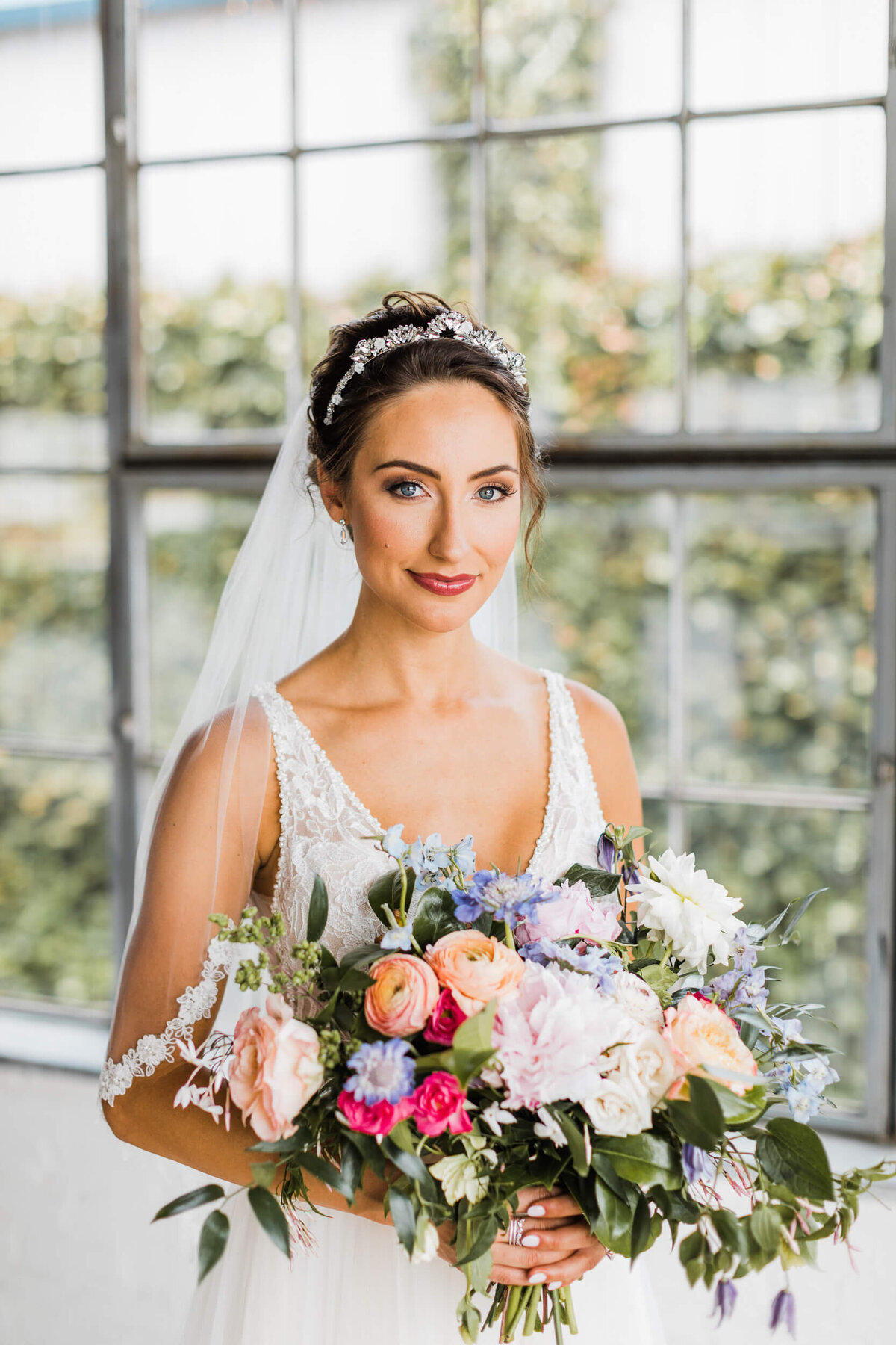 Bride with flowers at Hickory Street Annex by Opal & Onyx Photography