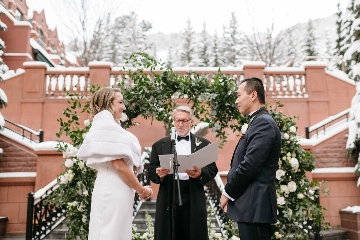 wedding ceremony vows in courtyard at St. Regis Aspen