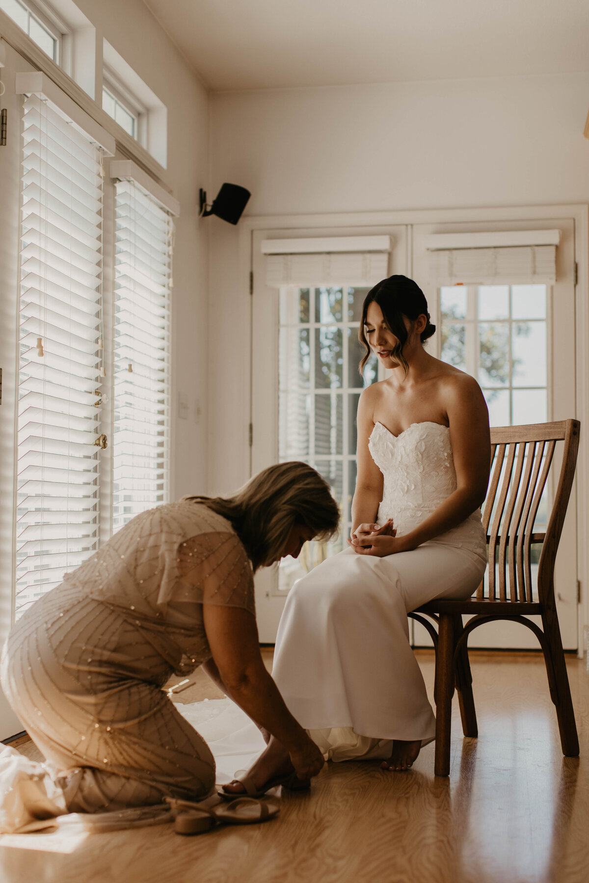 Mother of bride putting on shoes. 