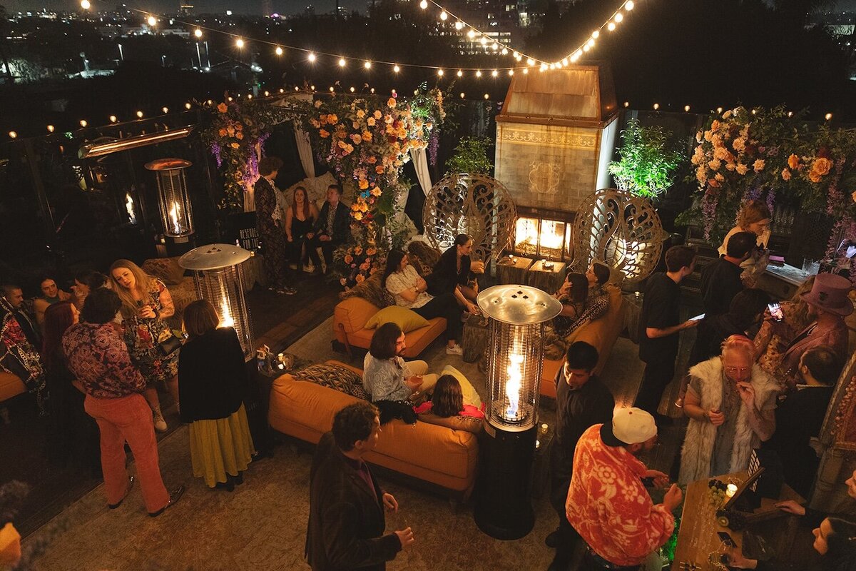 A cozy and whimsical lounge with a burning man party vibe at an engagement party at petit ermitage in Hollywood.