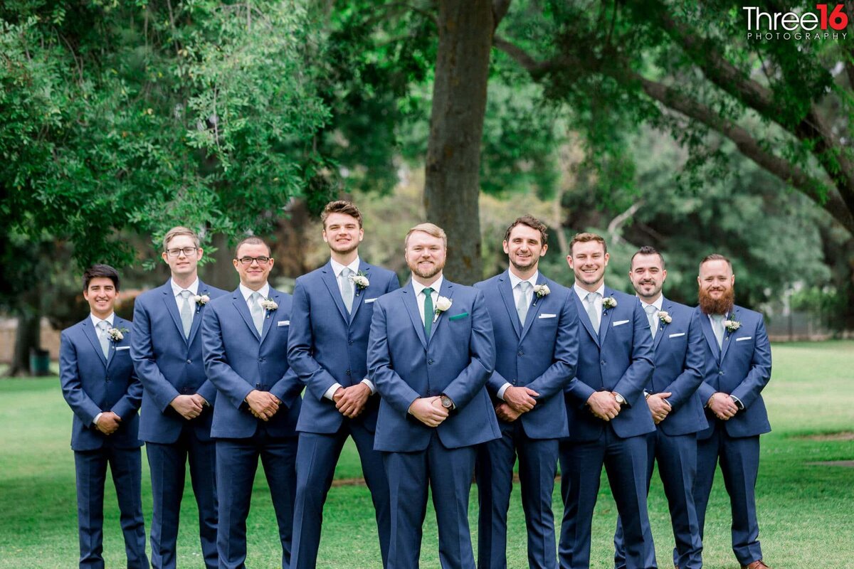 Groom poses with his groomsmen prior to the wedding ceremony