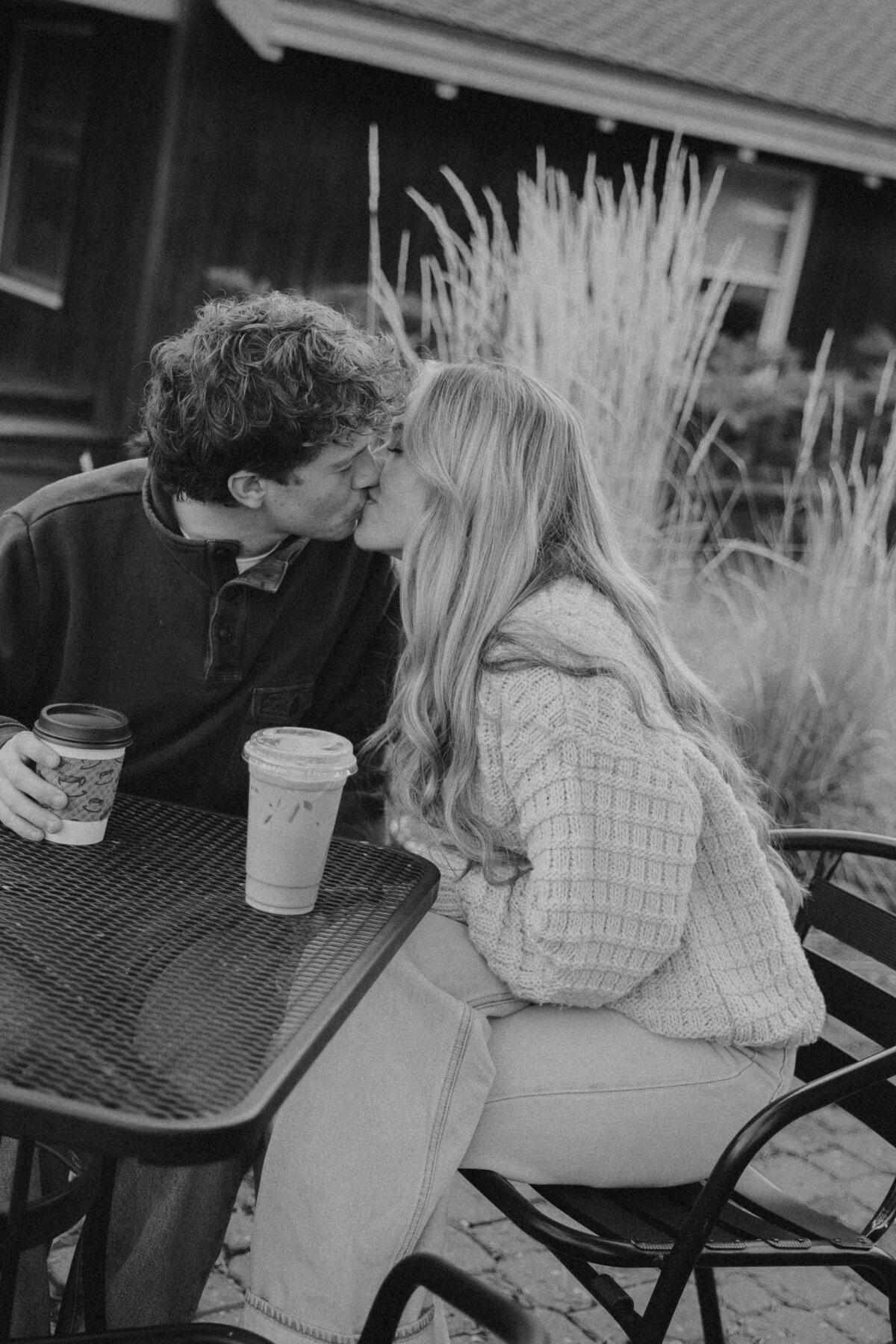 Cozy Coffee Shop Engagement Session in Oregon with Couple Sharing a Kiss