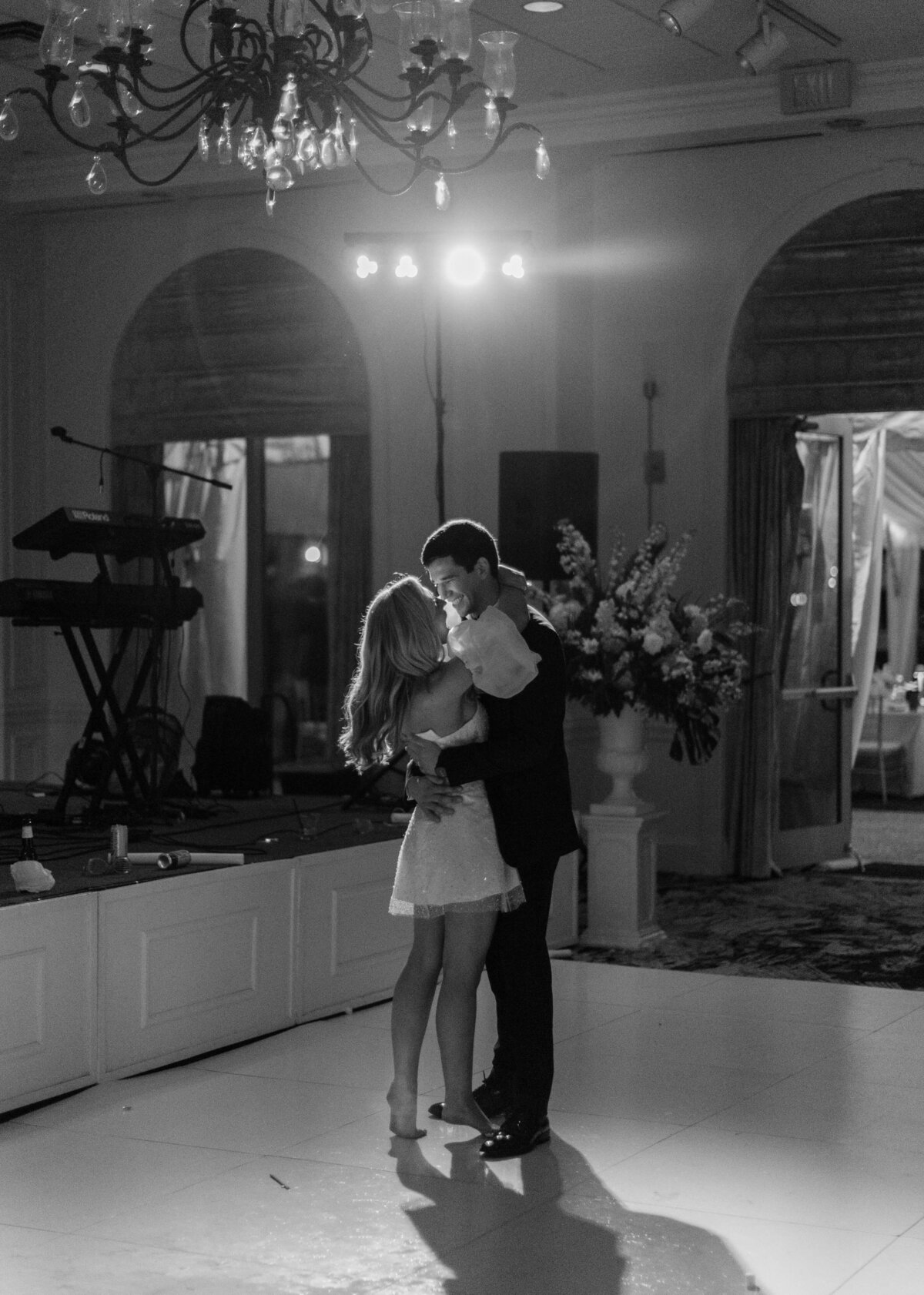 A husband and wife share a final dance at their wedding.