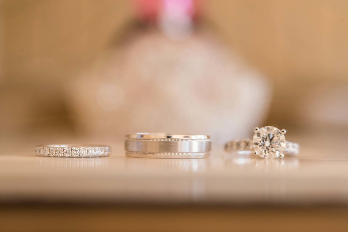 The bride and groom's wedding bands and the bride's engagement ring at Stonebridge Country Club