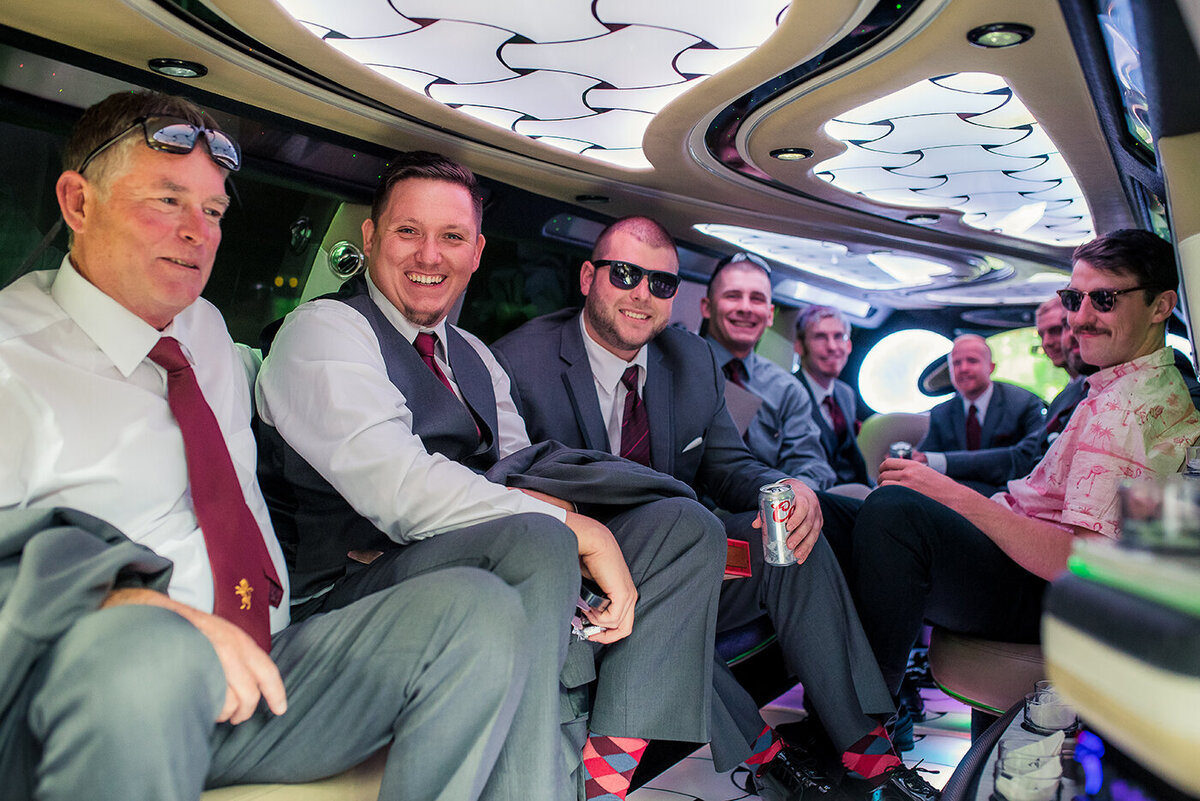 groomsmen in limousine