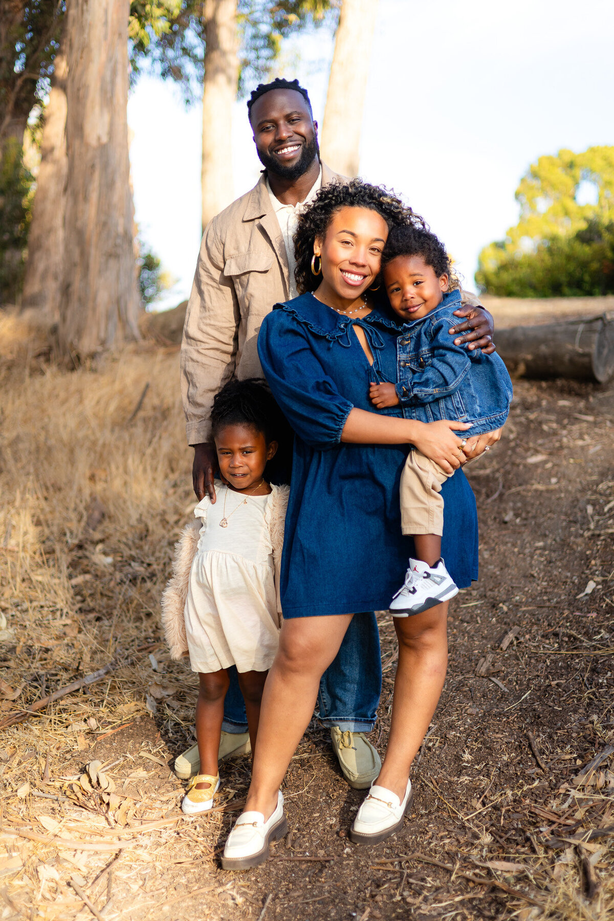 Family of four smiling together on woodland path, Bay Area Family Portfolio – Ellobelle Photography