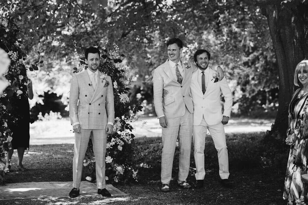 The grooms party waiting for the bride at Broadfield Court for an outdoor wedding