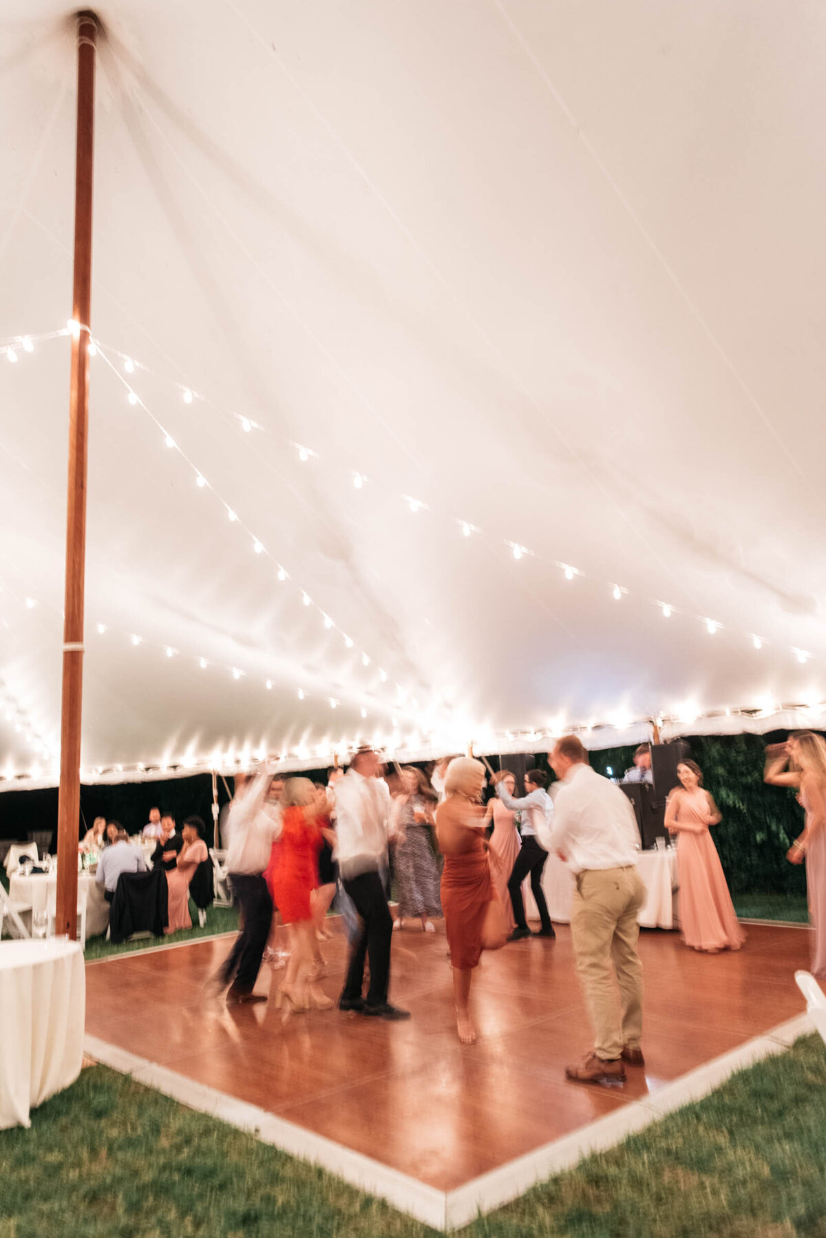 wedding dancing under a tented reception