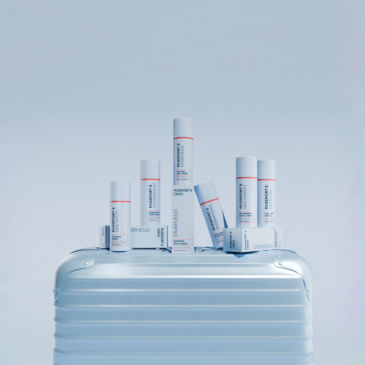 Packaging Design für Passport 2 Skin – sechs Skincare-Produkte gestapelt auf einem Koffer, Branding von studio bretz.