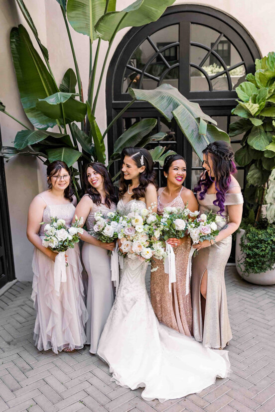 bride-and-bridesmaids-in-courtyard-the-guild-hotel-san-diego-wedding