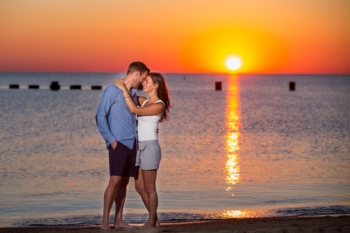 A casual engagement session on North Avenue beach captured at sunrise.