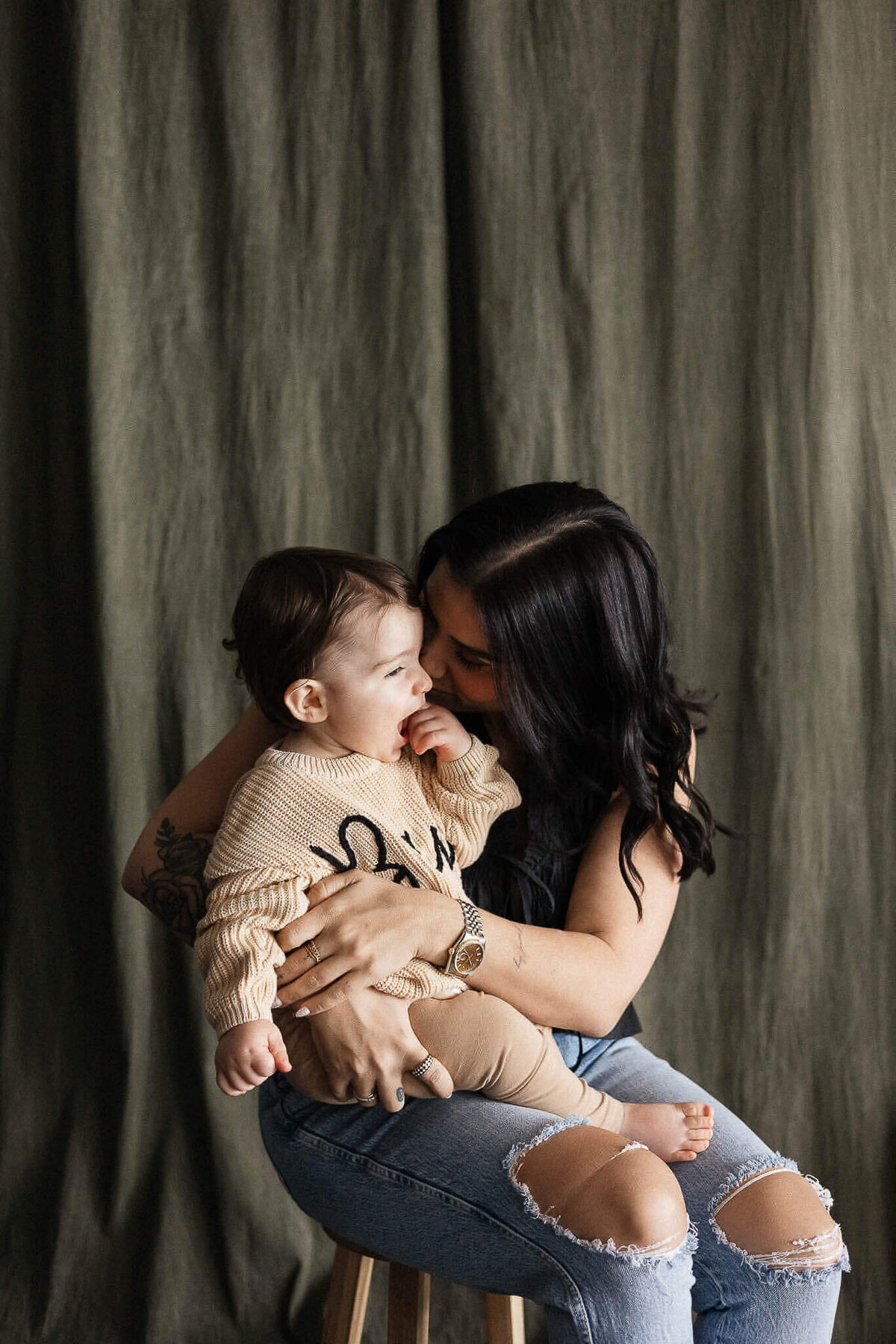 Mother hugging son during a studio lifestyle family photography session at Sixth City Studio in Cleveland.