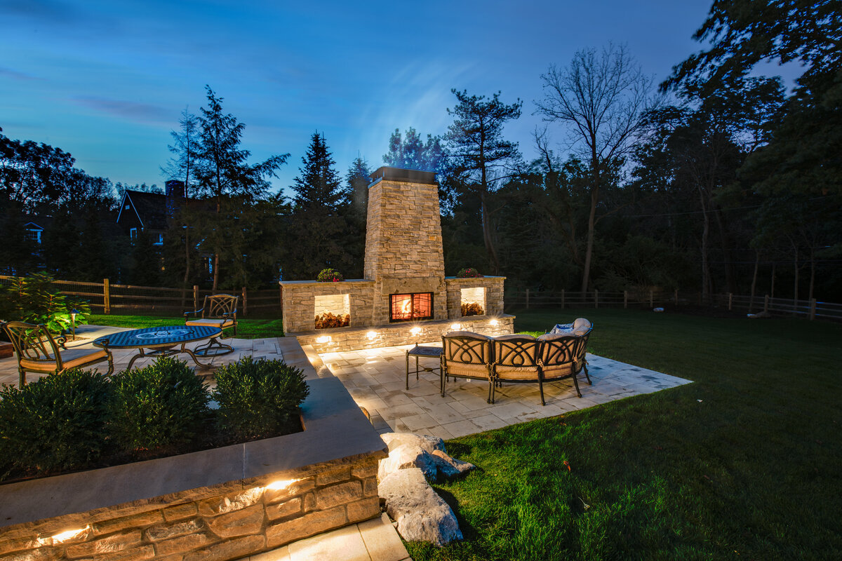 cozy-outdoor-living-space-featuring-firepit-and-wood-burning-fireplace-Ottawa hills - OH