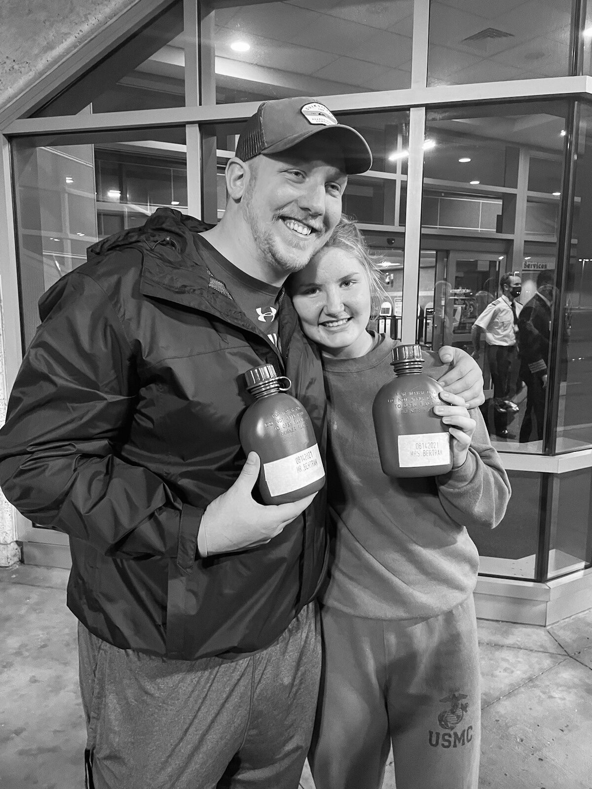 Abby Bertram poses with husband at her return from Marine Corps bootcamp in 2021.