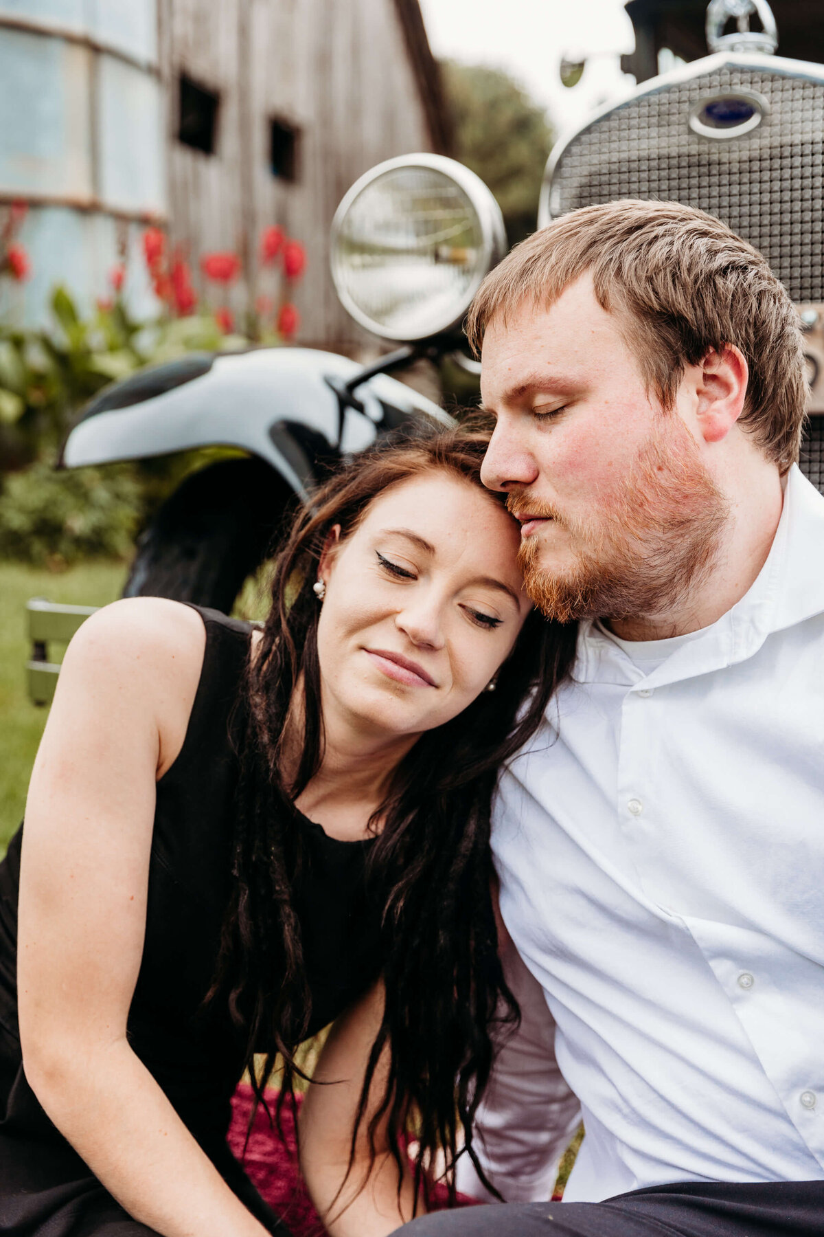 woman laying her head on fiances shoulder for engagement session