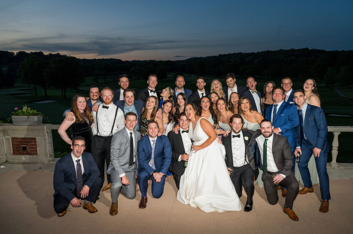 photo or large group of friends at wedding reception