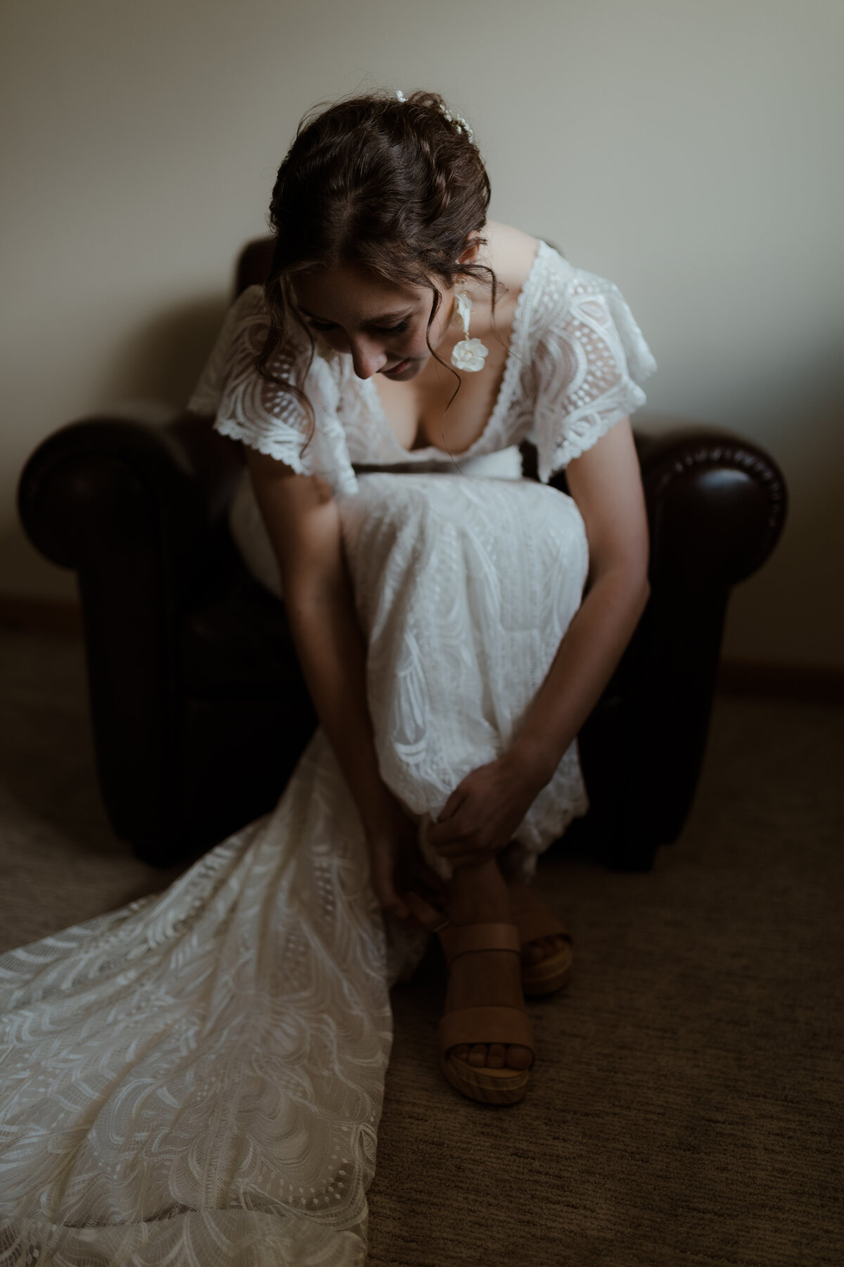 Bride putting on shoes