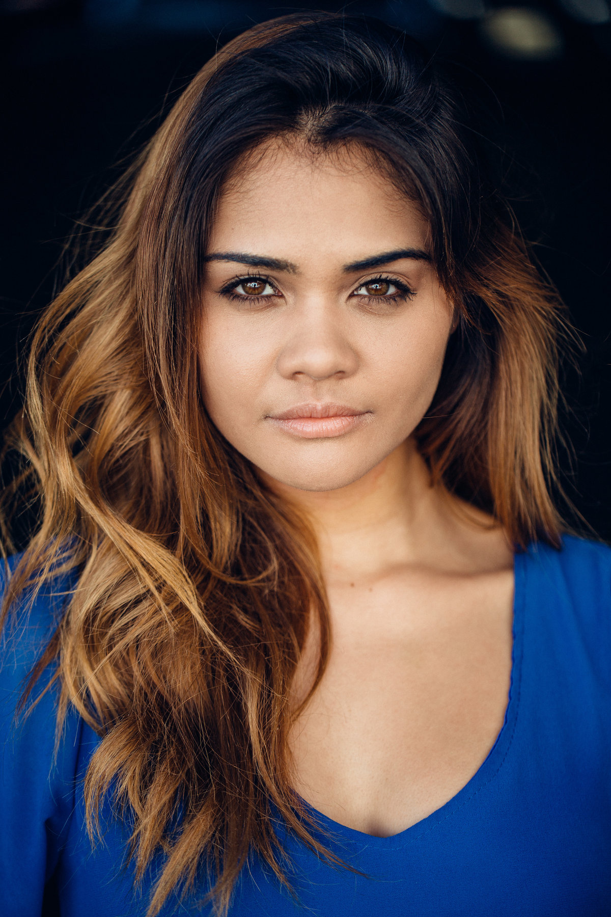 Headshot Photograph Of Young Woman In Blue V-Neck Shirt Los Angeles