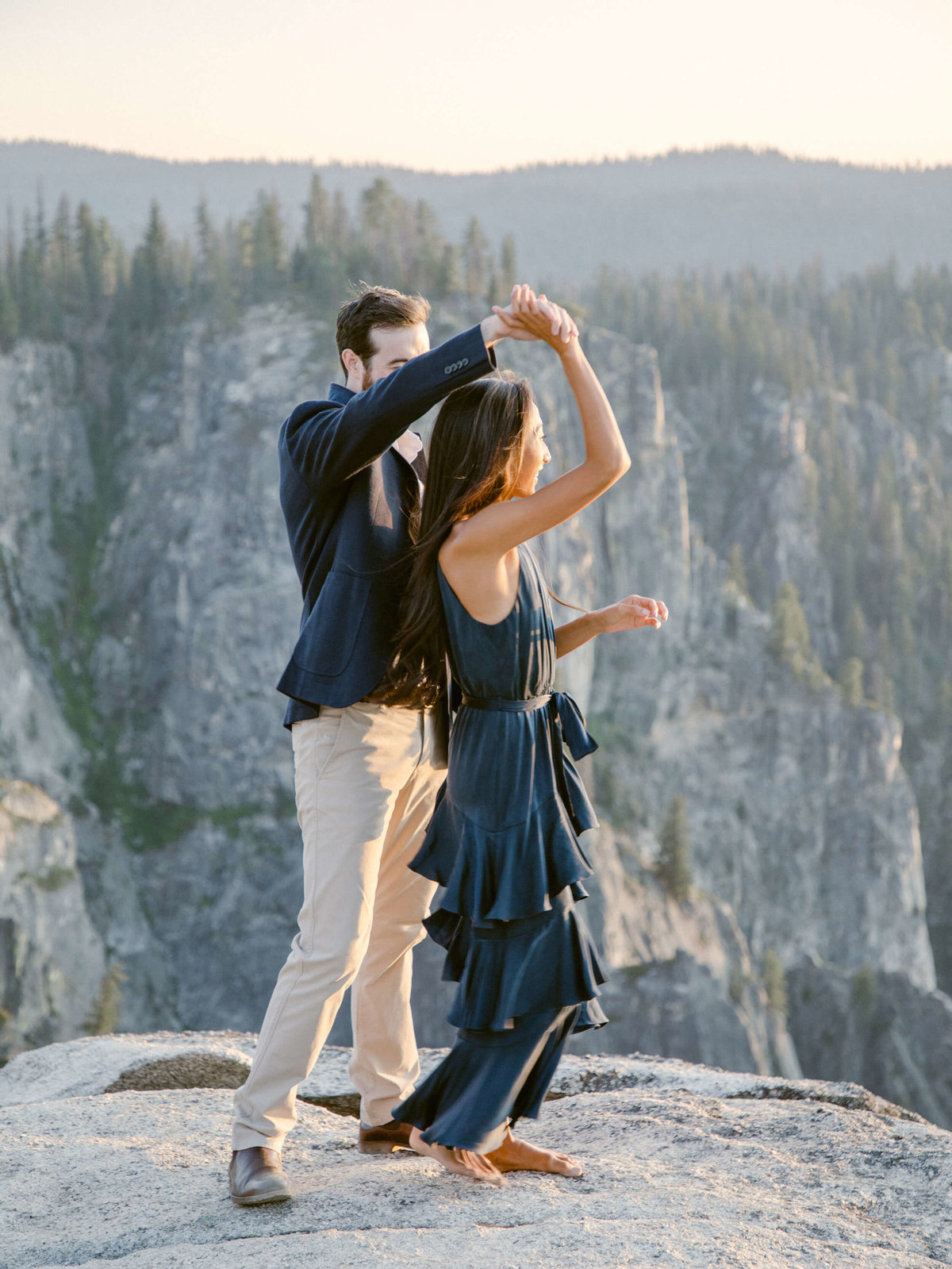 77-KTMerry-engagement-couple-dancing-Yosemite-mountain