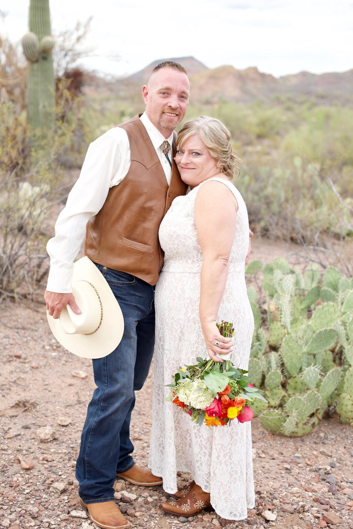 bride and groom in the desert